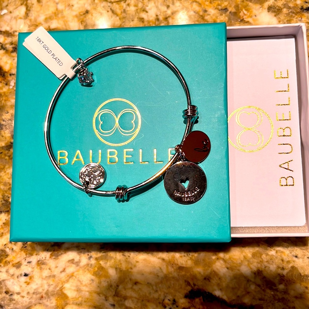 18 KT NWOT gold plated baubelle Bracelet with charms
